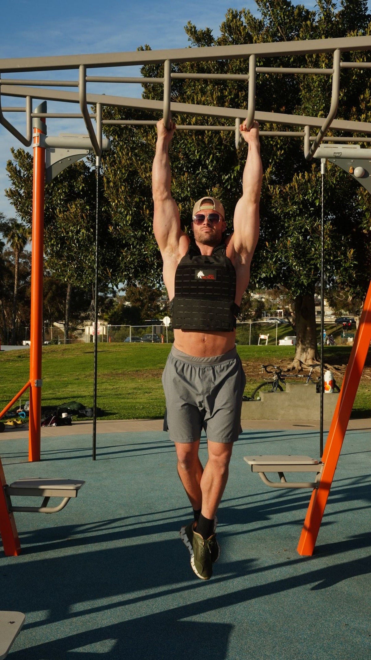 Pull-ups at an outdoor gym in the Wolf plate carrier